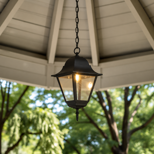Traditional black metal chain hanging tapered glass lantern pendant light from gazebo ceiling dome for garden yard decor.