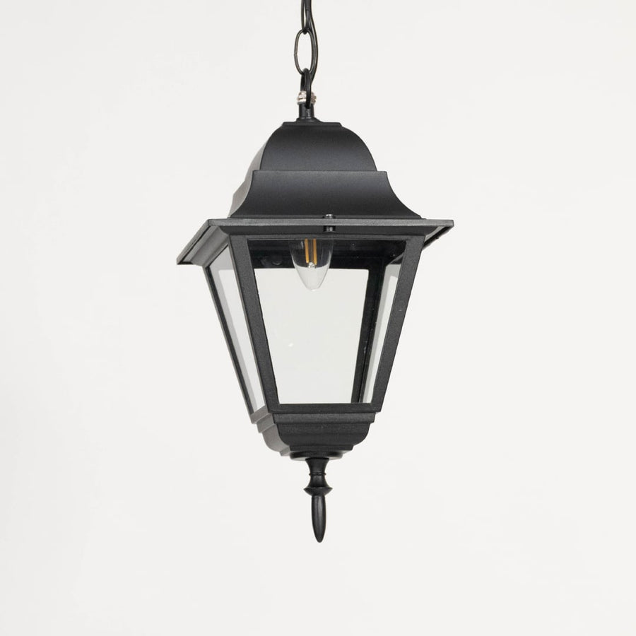 Elegant black metal hanging lantern light with clear glass shade for modern balcony and entryway decor.