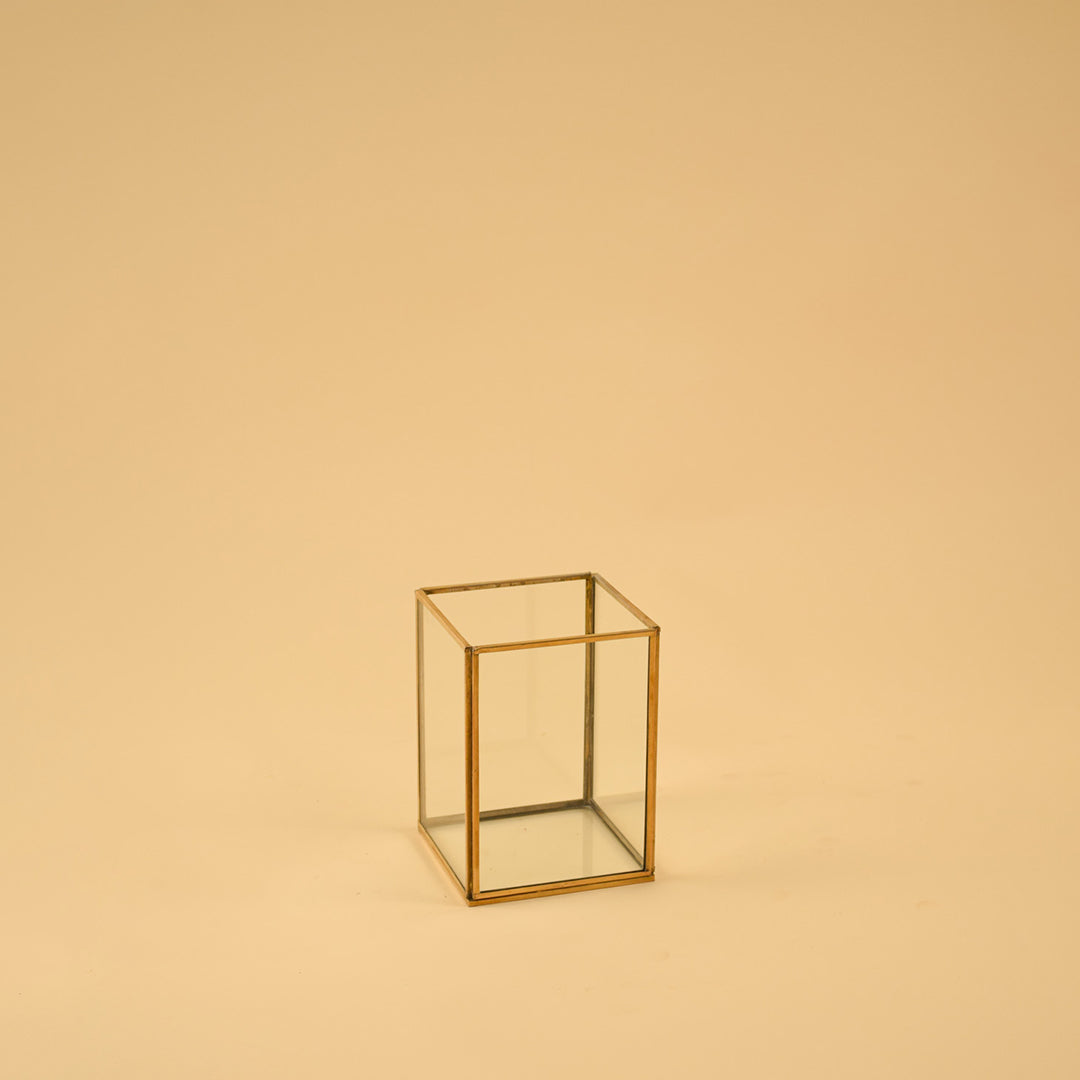 Simple rectangular brass framed glass vase for clean modern home decor and elegant minimalist tabletop accent styling.