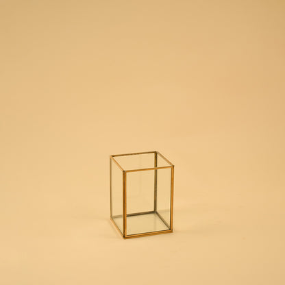 Simple rectangular brass framed glass vase for clean modern home decor and elegant minimalist tabletop accent styling.
