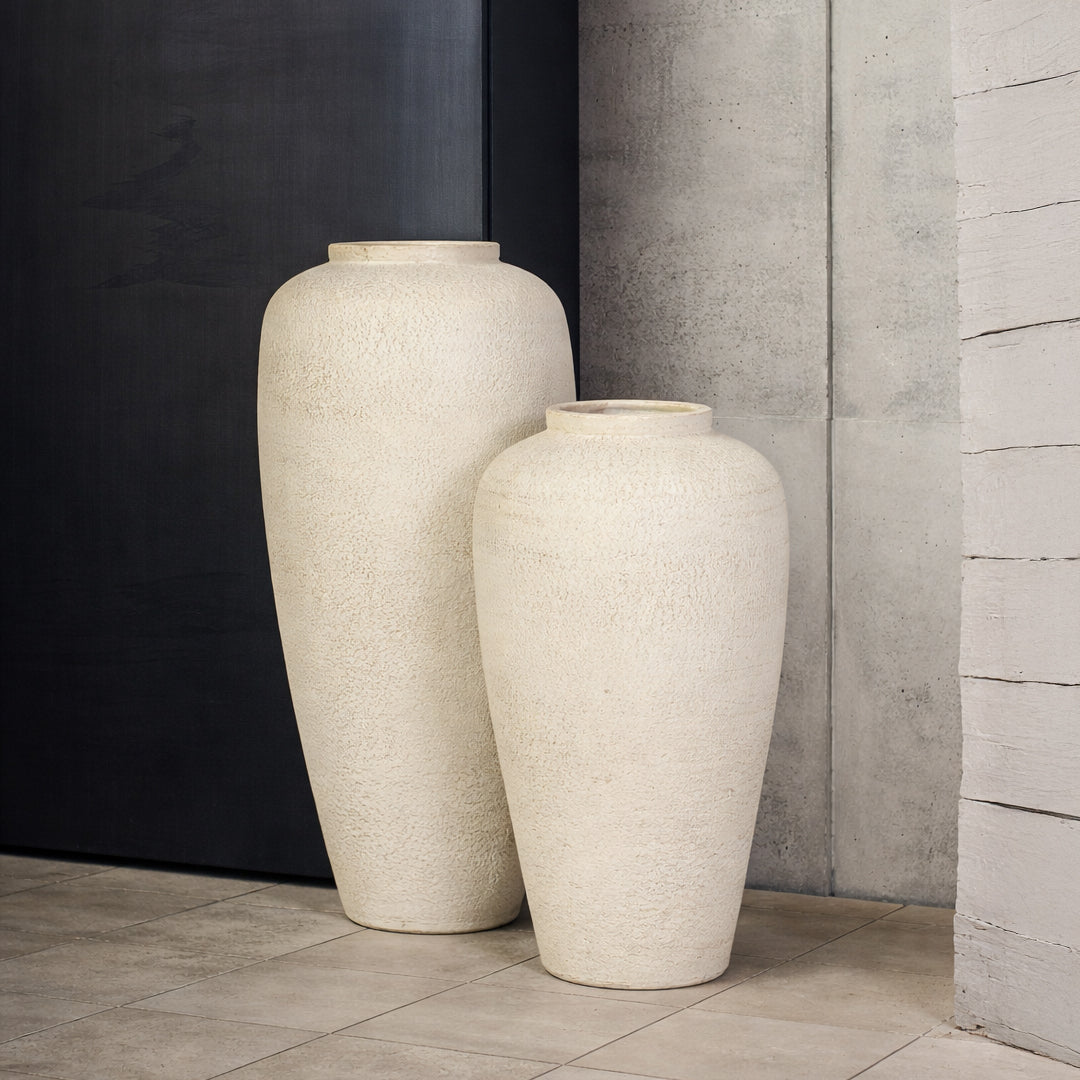 Lifestyle image of beige ceramic vase set for modern living room decor styling with textured matte finish.