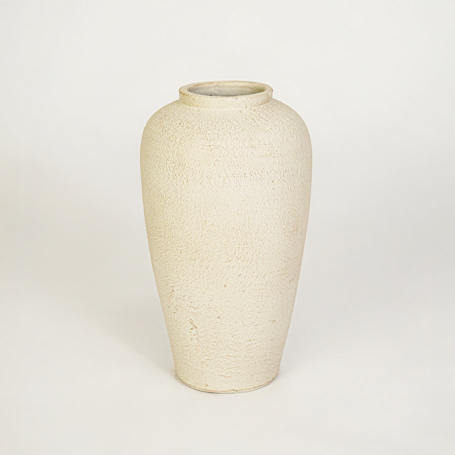 White background image of beige ceramic floor vase for elegant interior decor styling with textured matte finish.