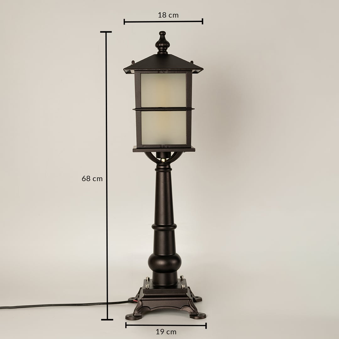 Closeup of outdoor lamp base in black metal finish highlighting sturdy pedestal design durable build and classic detailing.