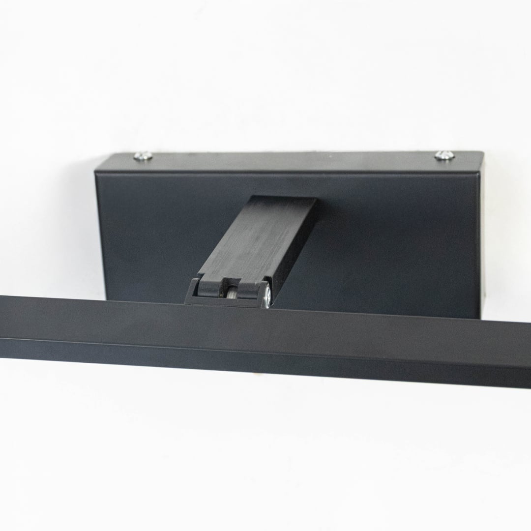 Sleek unlit black LED wall light on black background emphasizing minimalist form  precision finish  and linear silhouette.