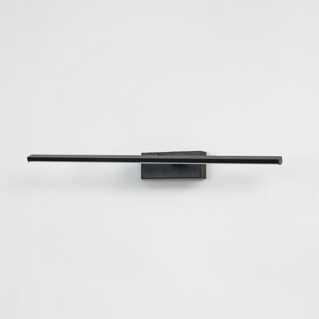Modern black LED wall light measuring 61 cm wide with slim rectangular profile designed for bathrooms or vanity spaces.