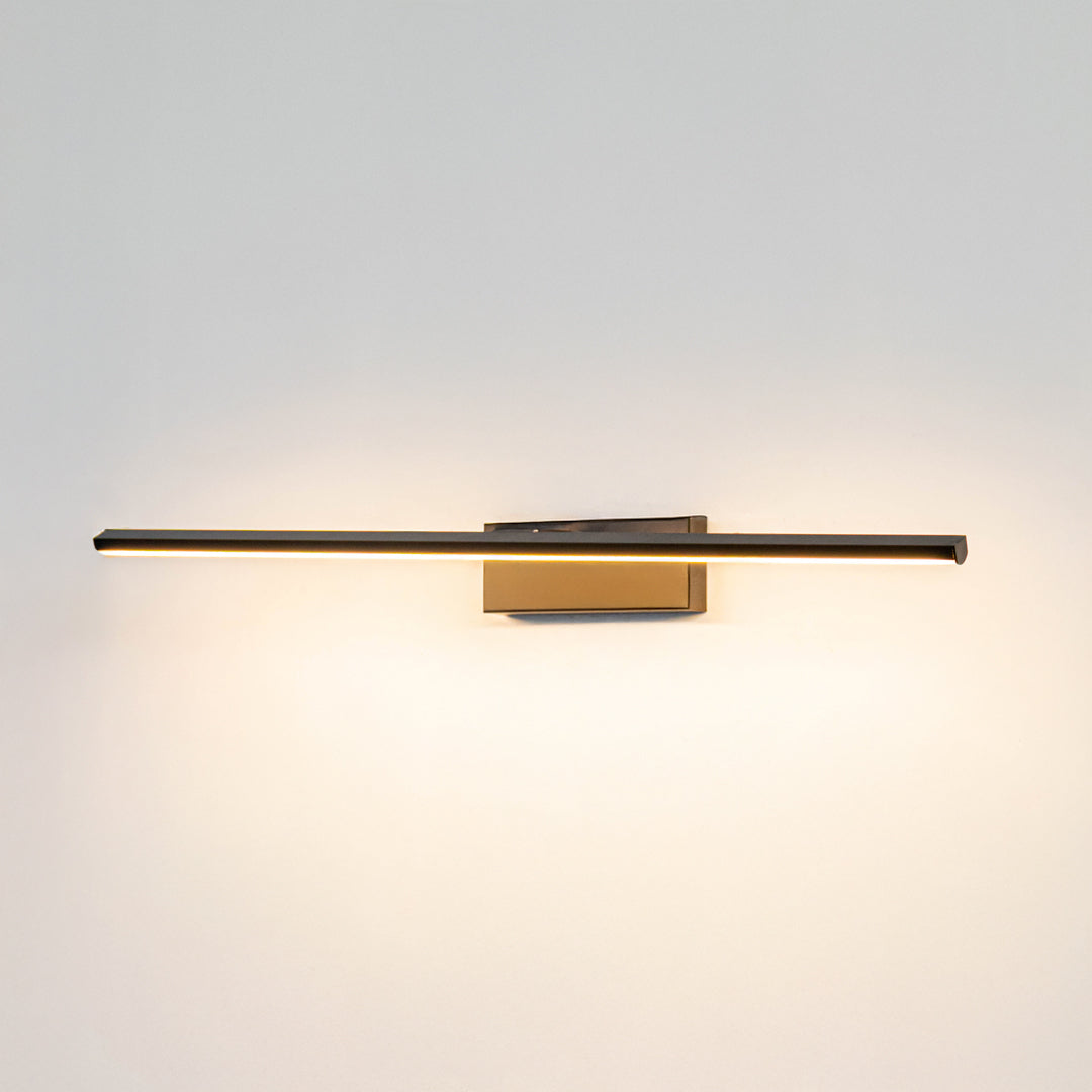 Minimal wall light in gold metal finish with linear bar design for bathroom or vanity decor lighting white background.