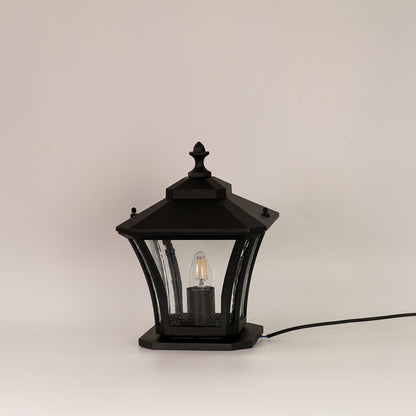 Black outdoor gate light with clear curved glass panels for stylish exterior decor styling use.