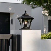 Vintage black metal and glass outdoor wall light for porch entrance garden and exterior walls with warm ambient lighting.