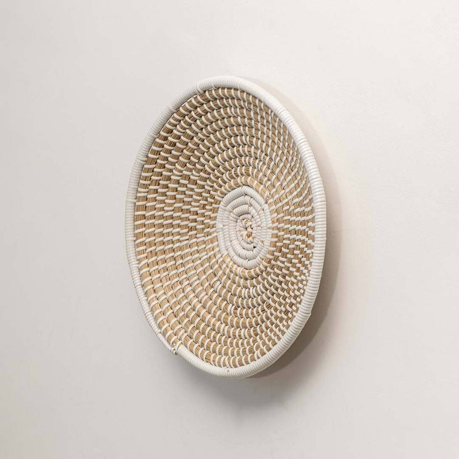 Natural woven seagrass wall basket for living room hallway and boho wall décor on white background image.