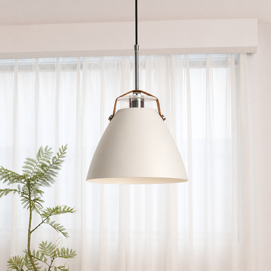 A modern pendant light with a large off-white conical shade, a polished silver metal collar, and a brown leather loop, hanging in front of sheer white curtains.