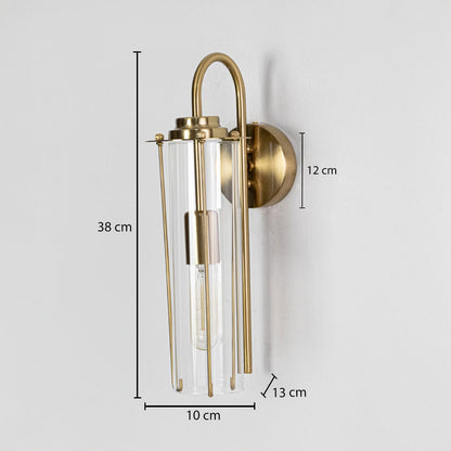 A gold wall sconce with a tall glass shade displayed with full measurements showing height 38 cm width 10 cm backplate height 12 cm and depth 13 cm.