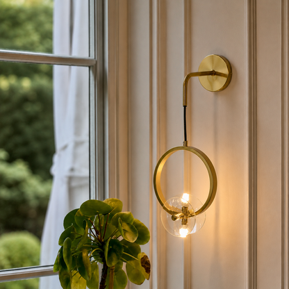 Lifestyle image of minimalist ring pendant wall hanging light for modern room decor styling with sleek elegant finish.