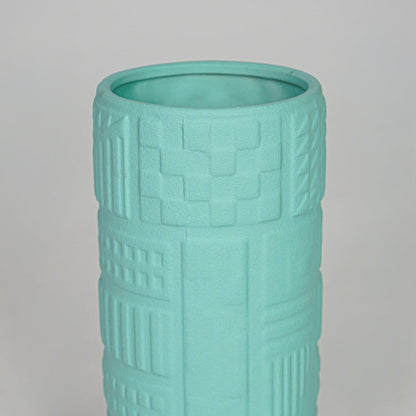 Closeup green textured ceramic vase surface detail modern decorative flower vase for table shelf console decor.