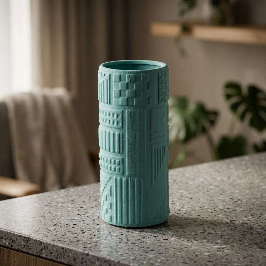 Green ceramic decorative flower vase placed on table modern aesthetic home decor styling idea.