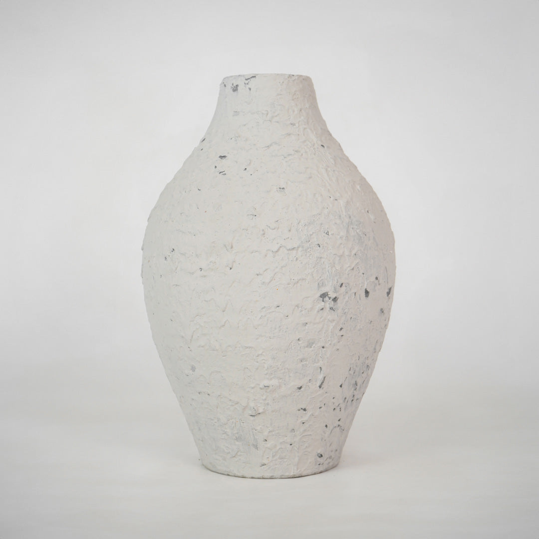 Minimalist textured white speckled ceramic vase for elegant modern home decor and refined interior shelf styling.