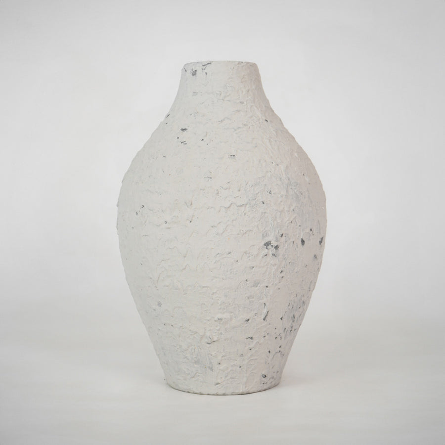 Minimalist textured white speckled ceramic vase for elegant modern home decor and refined interior shelf styling.