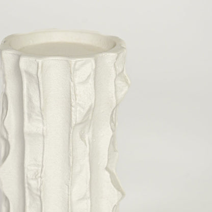 Closeup image of white ceramic textured vase for modern shelf placement with artistic matte finish styling display.