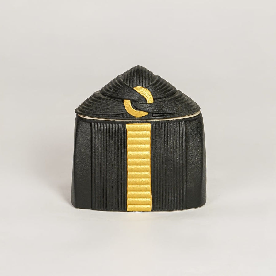 Black ceramic decorative jar with gold accent lid perfect for jewelry trinket storage on dresser vanity and modern decor.