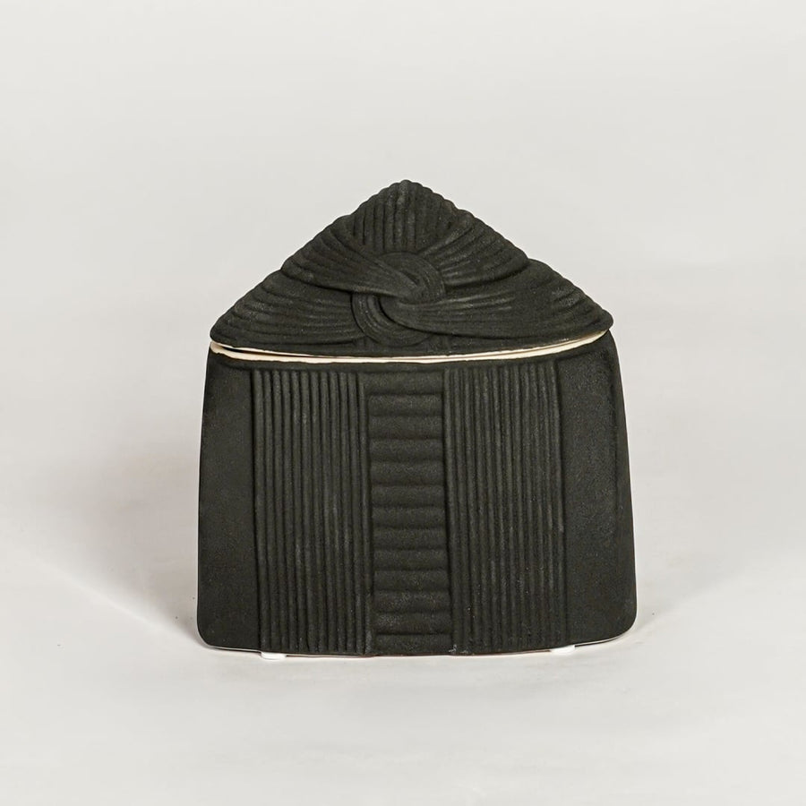Miso cone black ceramic vase with lid and ribbed texture isolated on clean white background for modern decor styling.