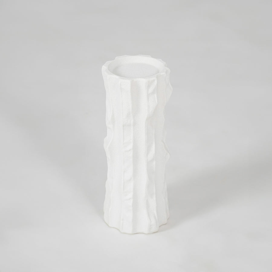White textured ceramic vase for modern shelf placement and elegant indoor home decor styling accent piece.