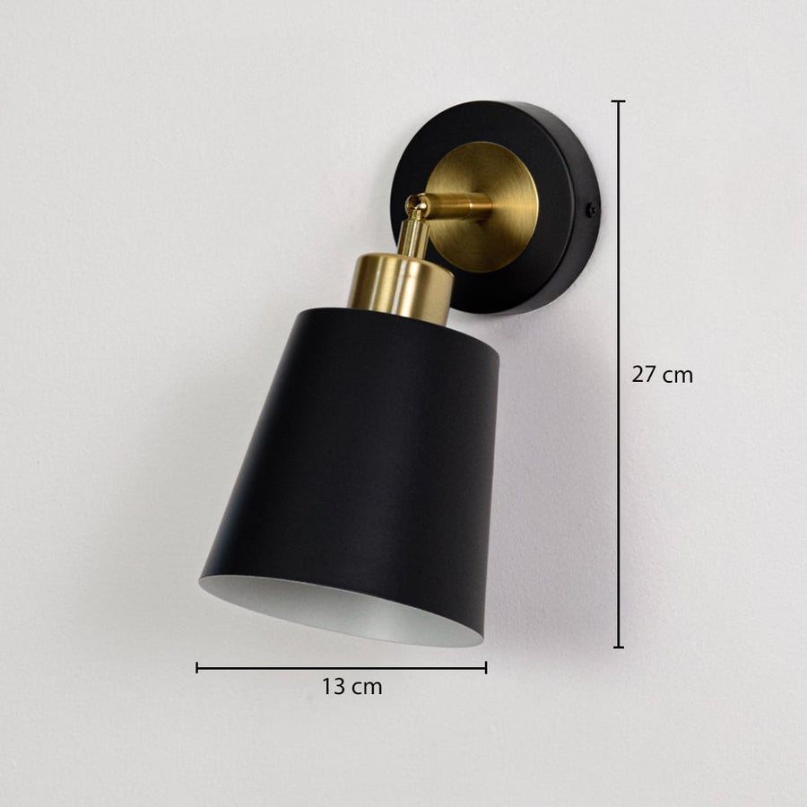 Black and gold wall light with cone shade shown with 23 cm height and 15 cm depth emphasizing compact design.