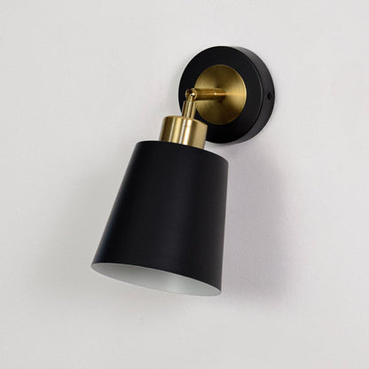 Black metal wall sconce with gold arm turned off on a white background showcasing clean finish premium material and modern design.
