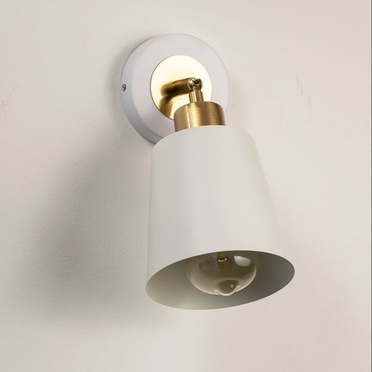 Modern white metal spotlight wall light with brass accents for elegant interior lighting decor.