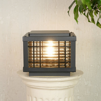 Black outdoor gate light with warm glowing bulb for elegant modern exterior decor styling use.
