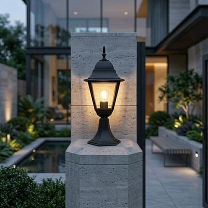 Black outdoor gate light with warm glow styled beside modern entrance for elegant exterior decor ambiance.