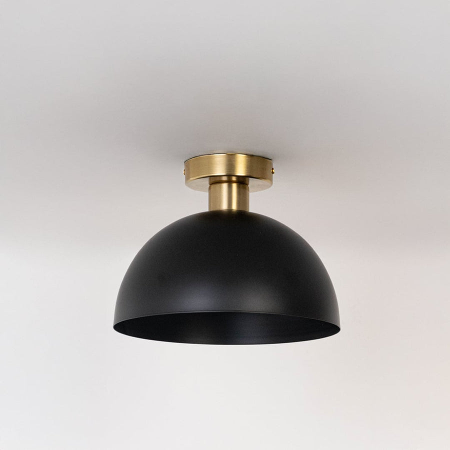 Black ceiling light with gold base and dome shade in off mode displayed on clean white background for modern ceiling decor.