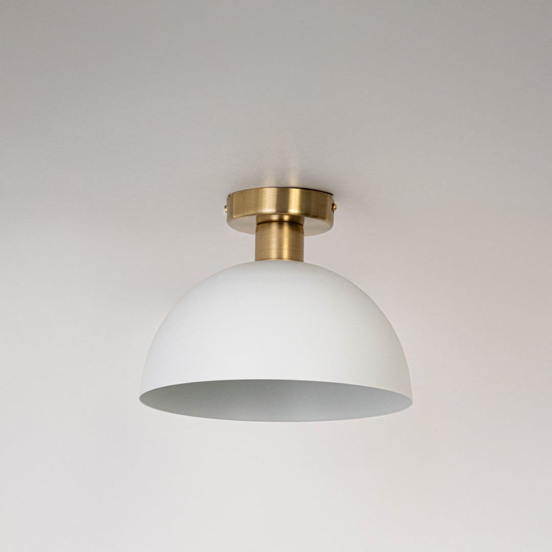 White ceiling light with gold fitting and dome shade in off mode displayed on clean white background for home interior lighting.