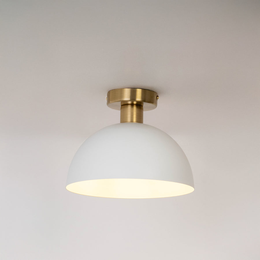 Modern white metal dome ceiling light with soft ambient lighting for elegant hallway and contemporary decor spaces.