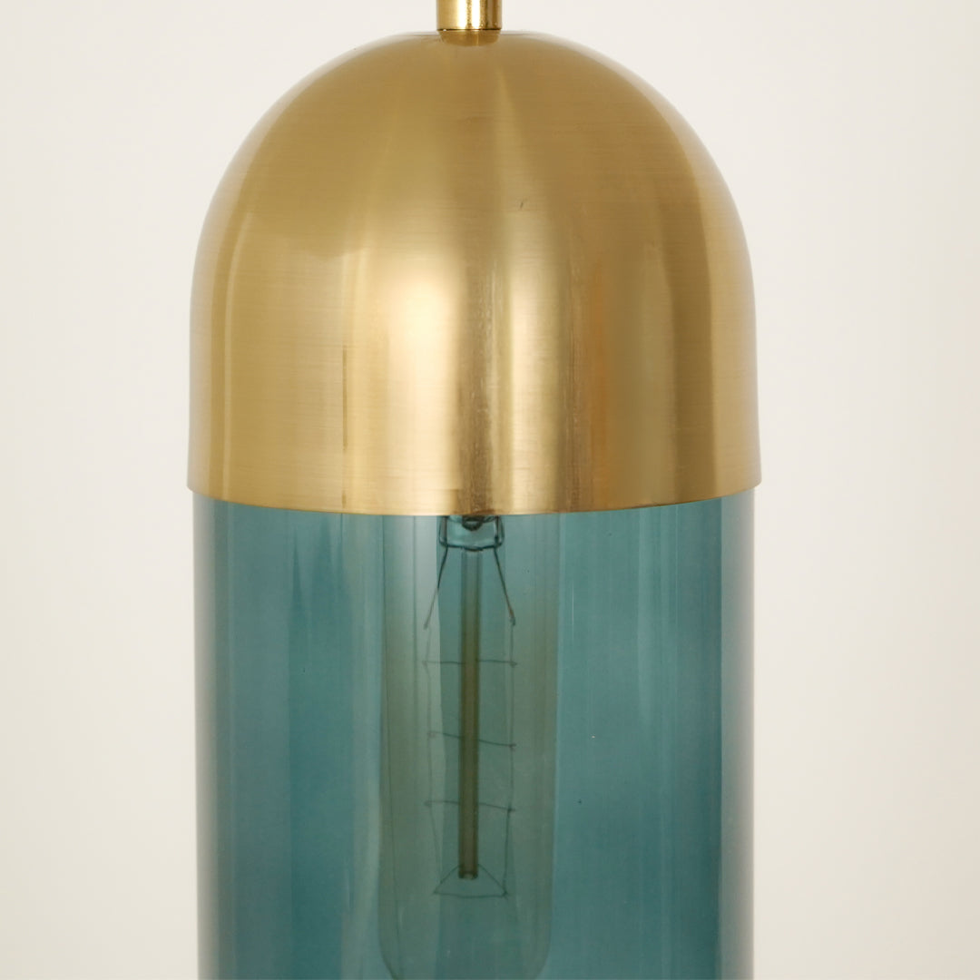 Closeup image of teal glass pendant light with brushed gold cap for refined ceiling placement.