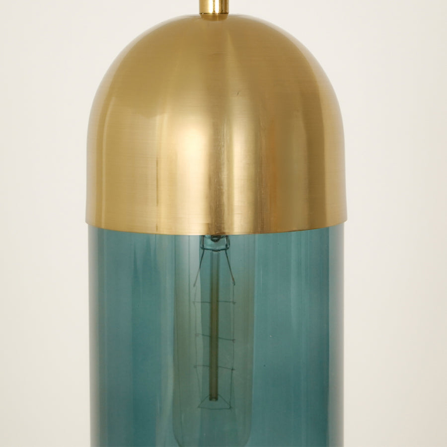 Closeup image of teal glass pendant light with brushed gold cap for refined ceiling placement.