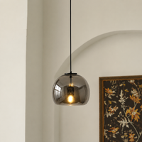Lifestyle image of modern black metal hanging pendant light for elegant dining room decor styling with beautiful finish.