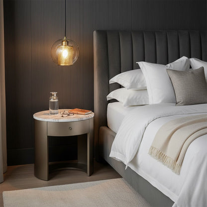 Set of gold and glass pendant lights glowing warmly in elegant living room interior adding luxury and modern ambiance.