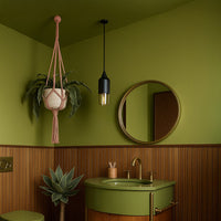 White metal pendant light with gold glass details enhancing vanity area decor with warm ambiance.