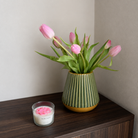 Lifestyle image of minimalist green gold ceramic vase for elegant room decor styling with modern smooth painted finish.