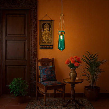 Elegant blue glass pendant light with gold frame hanging in a modern room with soft ambient lighting and bright illumination creating a calm decor feel.