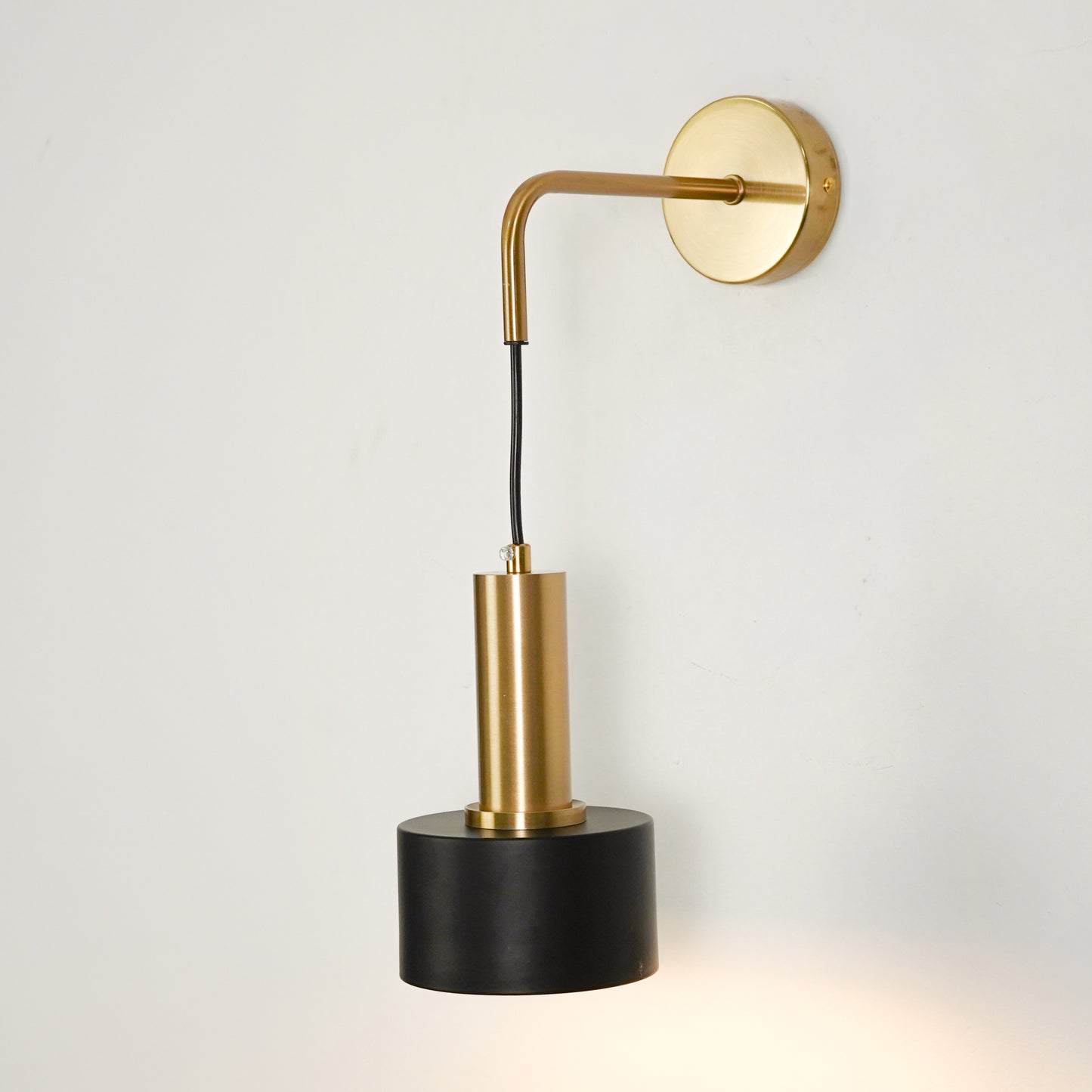 White background image of modern nordic golden wall lamp for elegant bedroom decor styling with bright illuminated finish.