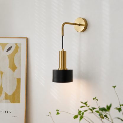 Lifestyle image of modern nordic style golden wall lamp for elegant bedroom decor styling with luxurious metallic finish.