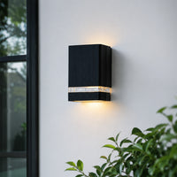 Modern black metal up down LED wall light for porch entrance patio and exterior walls with warm ambient lighting.