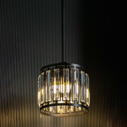 Crystal glass chandelier with gold metal frame illuminated for luxurious contemporary spaces.