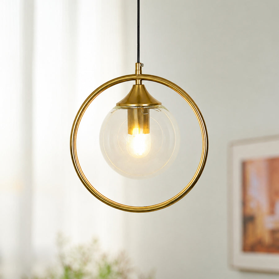 Gold ring pendant light with clear glass shade suspended beautifully in bright modern interior decor.