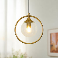 Gold ring pendant light with clear glass shade suspended beautifully in bright modern interior decor.