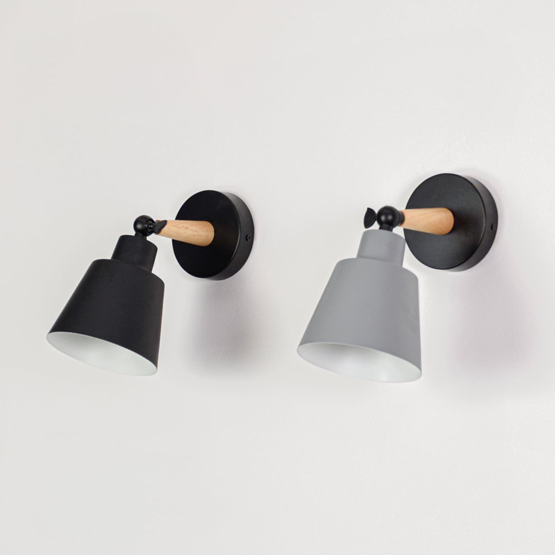 Pair of wall lights displayed together glowing showing color variation and consistent design ideal for coordinated lighting across modern interior spaces.
