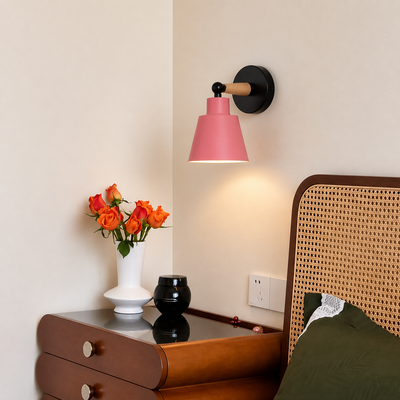 Lifestyle image of pink modern wall light for elegant bedroom decor styling and contemporary home lighting.