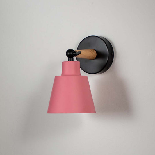 Wooden wall sconce with pink conical lampshade light off white background for bedroom study and hallway modern decorative wall lighting decor.