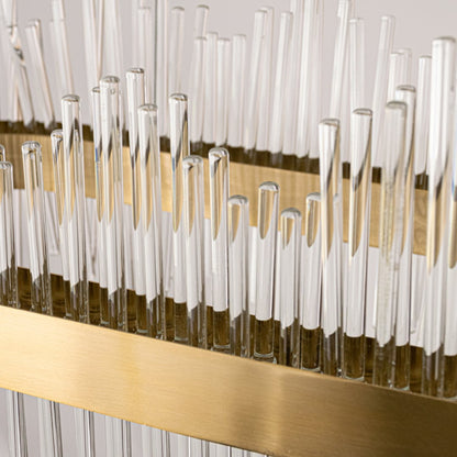 Closeup of gold metal chandelier highlighting the detailed glass rods and polished metal band designed for elegant premium interior lighting.