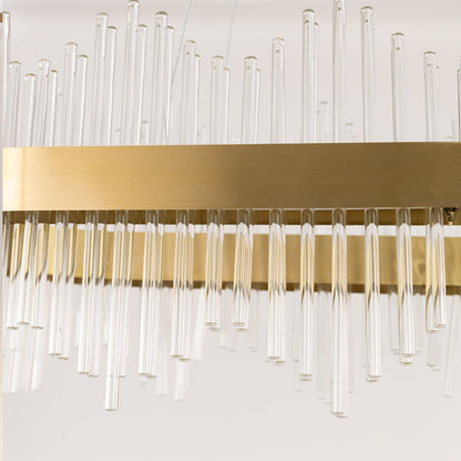 Detailed closeup of gold metal chandelier showing the textured glass rods and gold finish ideal for luxurious modern home decor.